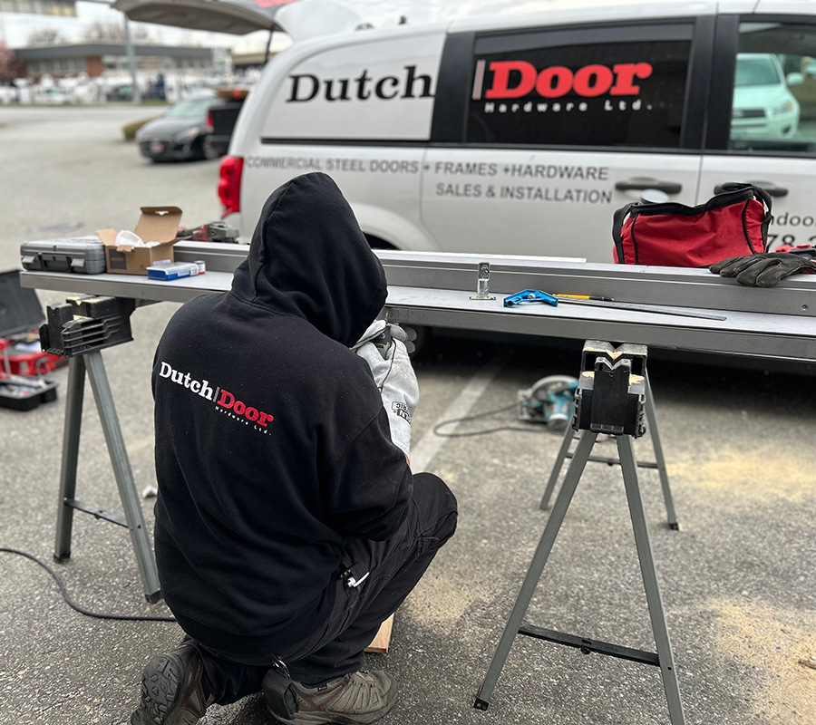 On site technician working on steel door