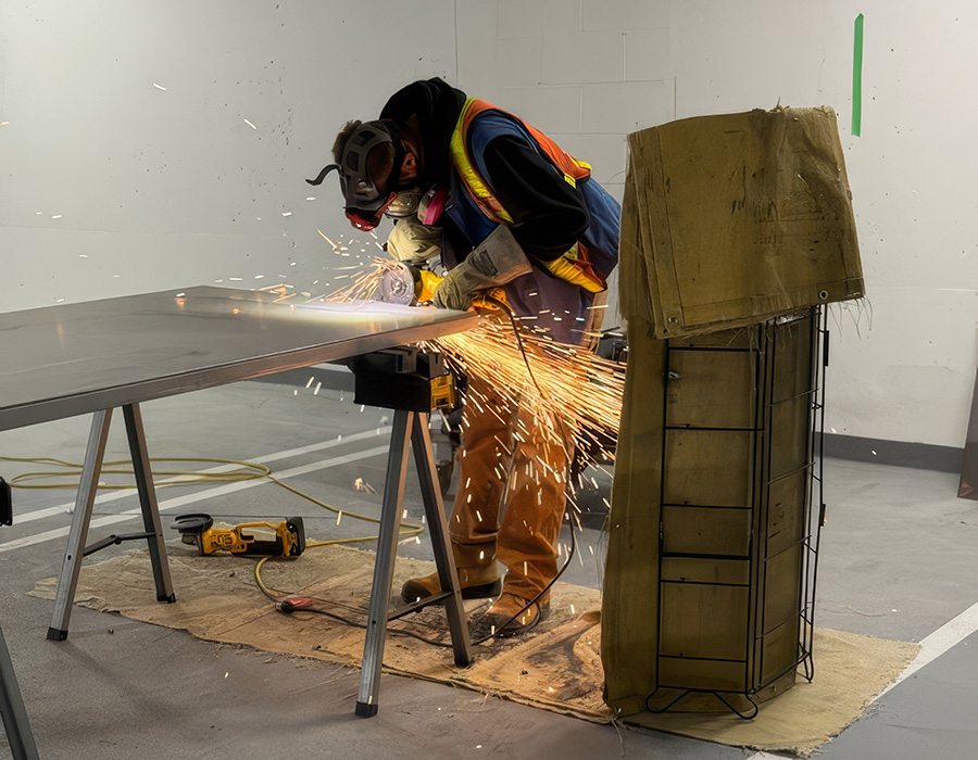 Technician working on steel door