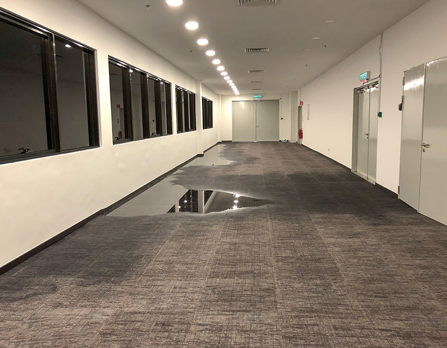 Commercial building with water leaks on floor