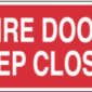 A rectangular red sign with white text that reads 'FIRE DOOR KEEP CLOSED.' The sign has a bold, capitalized font for clear visibility and is outlined with a thin black border.