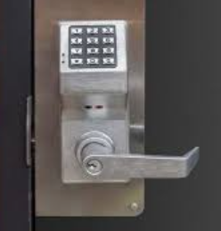 Commercial keypad door lock with lever handle.