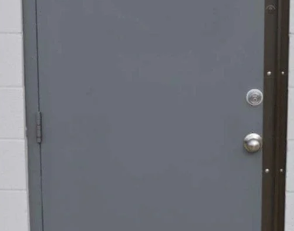 Single steel door reinforced with a security astragal installed along the latch side.
