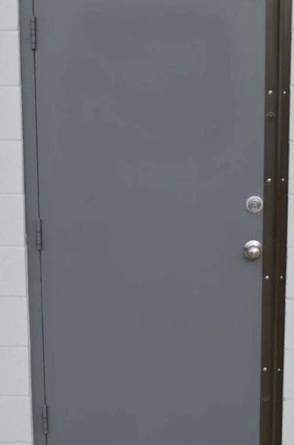 Single steel door reinforced with a security astragal installed along the latch side.