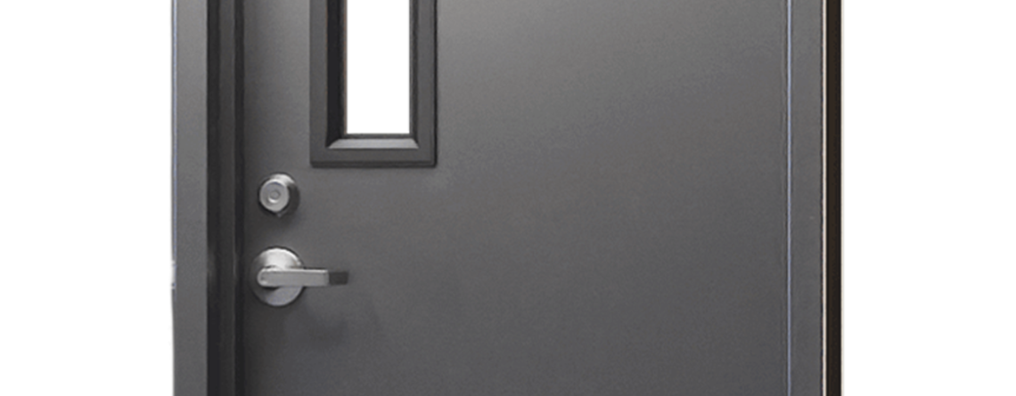 Commercial hollow metal door with vision lite installed in a school hallway