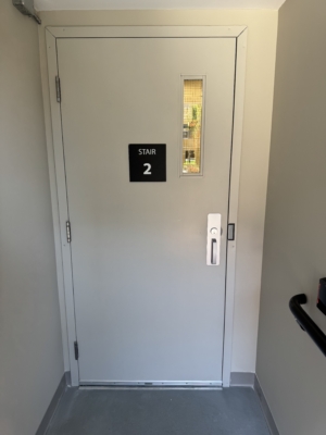 Exterior commercial stairwell door with access hardware