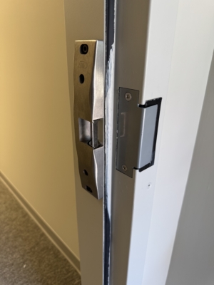 Commercial door latch and strike alignment