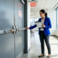 Property manager inspecting commercial door maintenance in Vancouver